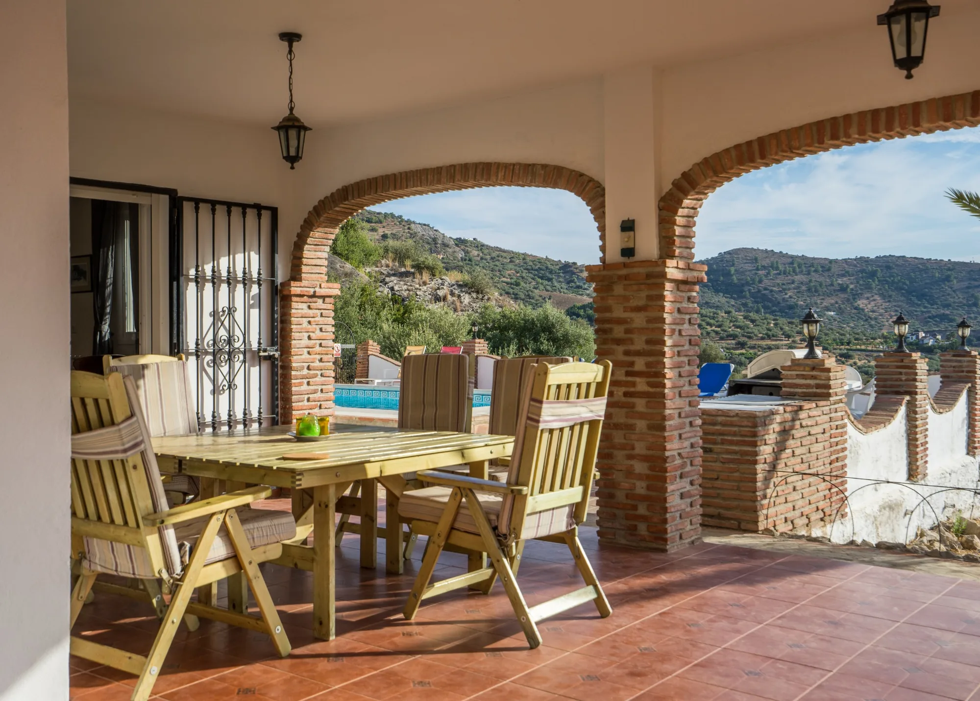Shaded outdoor dining terrace at La Roca